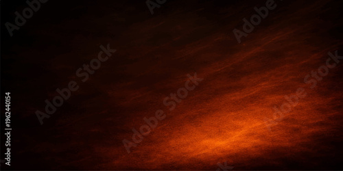 Abstract fiery explosion background with orange sunset clouds and red smoke texture under a beautiful dark storm sky at dusk
