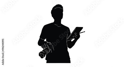 Silhouette of a photographer with camera and tablet