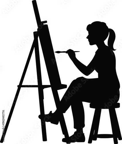 Silhouette of a female artist sitting on a stool painting on a canvas placed on an easel, depicting creativity and artistic pursuit in monochrome