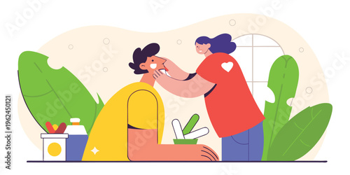 A friendly caregiver applying medical ointment to the cheek of a young man in a home environment