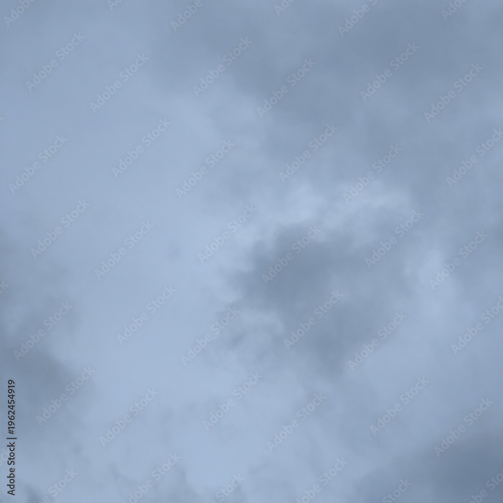 Fototapeta premium Shows a sky filled with various shades of gray clouds, indicating an overcast day or an imminent storm.