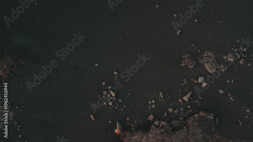 drone shot of a bridge between continents in Iceland black soil