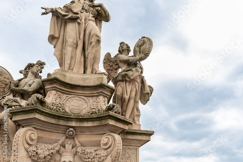 Part of the Statue of St Francis Borgia on Charles Bridge in Prague old city in Czech Republic