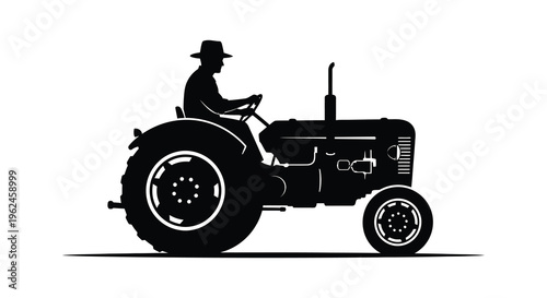 Silhouette of a man driving a vintage tractor in profile view