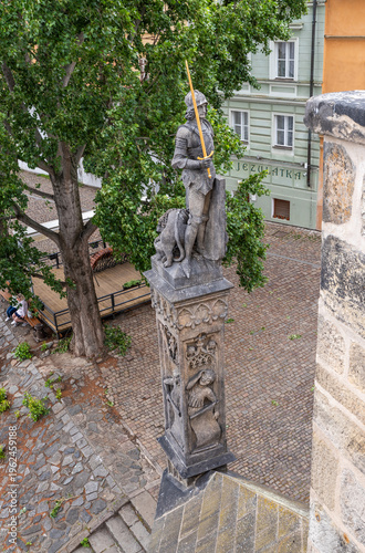 Statue of Bruncvík and his Faithful Lion on Charles Bridge in the Prague old city in Czech Republic