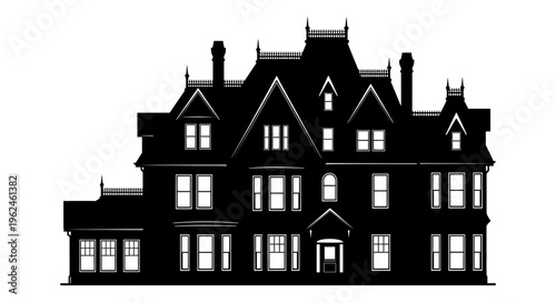 Silhouette of a large victorian style house with multiple gables and chimneys