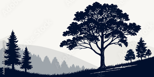 A large tree standing on a hill with smaller trees in the background