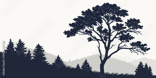 A large tree stands tall in a mountainous landscape