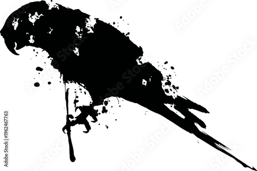 black ink splatter silhouette of parrot perched on branch with abstract paint drops background