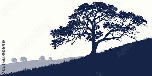 A solitary tree stands tall on a hillside under a clear blue sky.