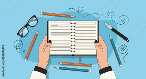 Top down view of hands holding an open spiral notebook on a blue workspace surrounded by pencils, glasses, and decorative swirls.