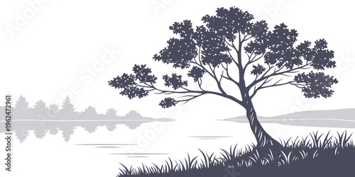 A solitary tree stands tall on a hill overlooking a serene lake at sunset.