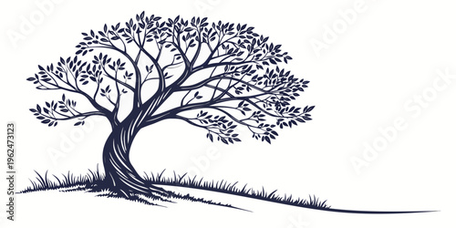 A majestic tree standing tall on a grassy hill with a clear blue sky in the background