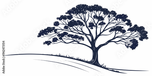 A majestic tree standing tall on a gentle hillside landscape.