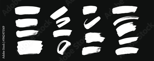 Collection of white brush strokes on a black background