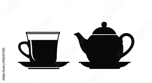 Black and white silhouette of a teapot and matching teacup