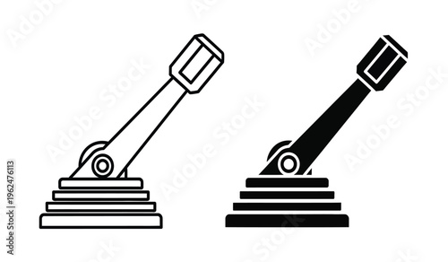 Silhouette of two identical mechanical objects on pedestals in black and white