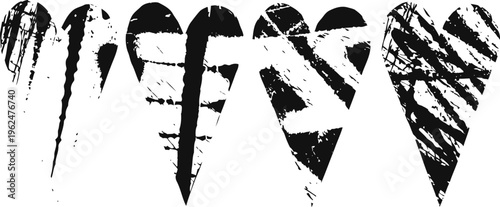 Grunge black heart silhouettes with different distressed brush stroke textures on white background