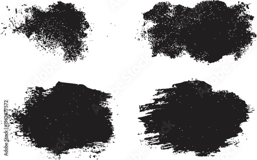 set of four black grunge paint splashes with splatter textures and rough distressed edges