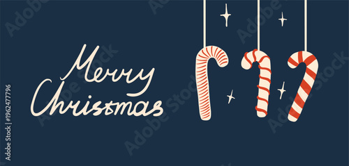 Hand drawn retro style Christmas greeting banner with candy canes and handwritten Merry Christmas lettering text on a dark blue background