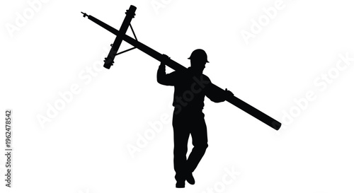 Silhouette of a lineman carrying a utility pole on his shoulder