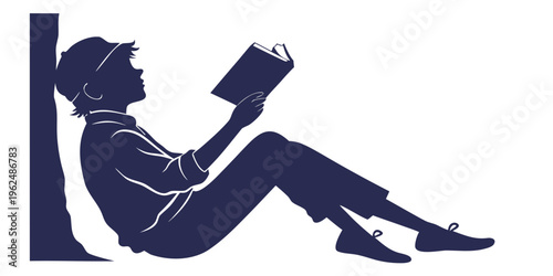 A silhouette of a person sitting on the floor reading a book