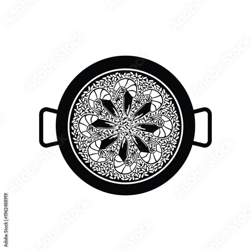 Overhead view of a paella pan with intricate food design.