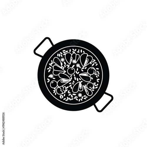 Paella dish with seafood and rice.