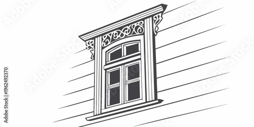 A beautifully designed window with intricate carvings on the exterior wall of a building.
