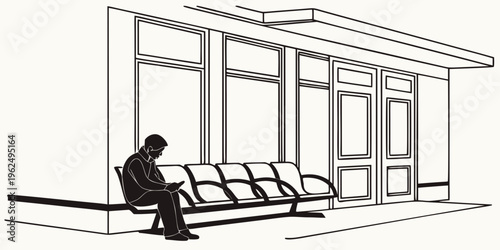 A person sitting on a bench outside a building with large windows