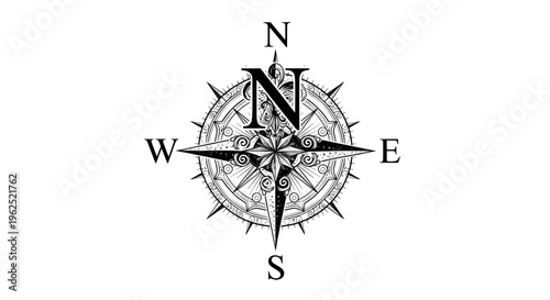 Vintage black and white compass rose with ornate swirls and star center