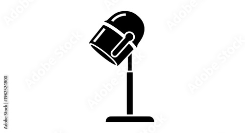 Minimal black and white desk lamp with curved top and handle