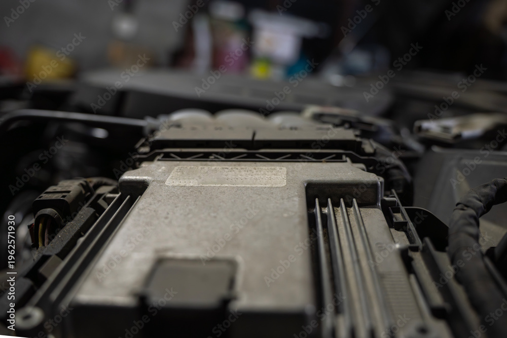 Ταπετσαρία Car engine control unit closeup inside engine bay, metal electronic module with connectors and wiring, automotive control system component