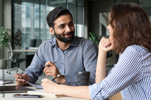 Fotografía Interview of happy smiling indian hr manager with latin young professional and friendly support discussing job cv