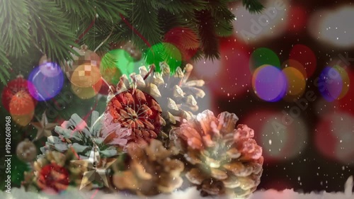 Animated seamless Christmas scene with snow and pine cone decor.