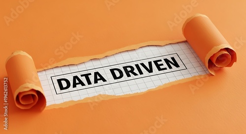 Data Driven Concept Revealed Through Torn Orange Paper.