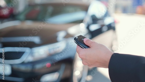 Concept of driver opening automobile with electronic device