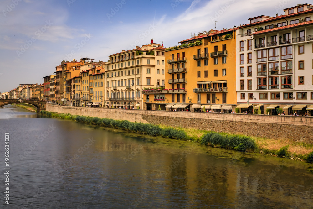 Fototapeta premium Cityscape with medieval gothic buildings near the famous bridge of Ponte Vecchio on the river Arno River in Centro Storico, Florence, Italy