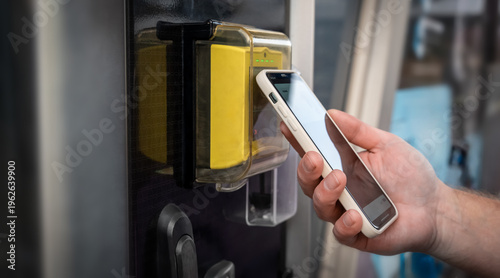 Φωτογραφία Contactless mobile payment with smartphone at electronic terminal
