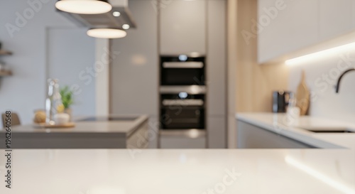 Professional kitchen environment with built in microwave stove and large refrigerator in a modern open plan house