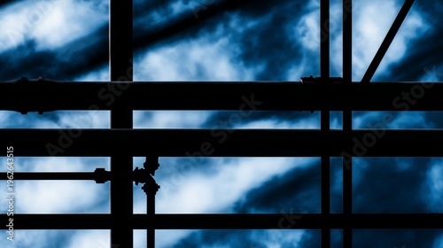 pipes. Industrial pipes and structures forming geometric patterns against a c...