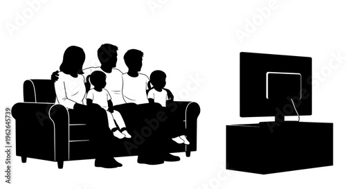 Family sitting on couch watching television together at home