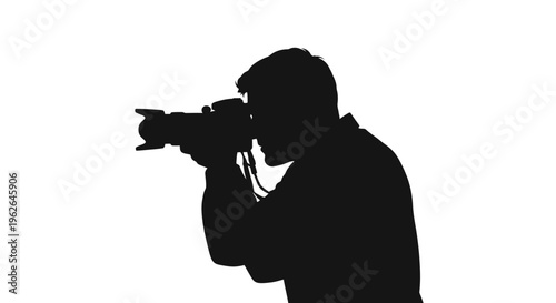 Silhouette of a photographer taking a picture with a camera