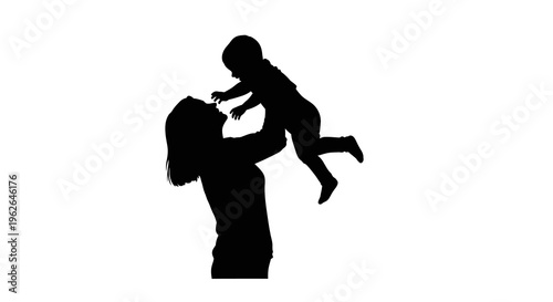 Silhouette of a woman lifting a baby up in the air