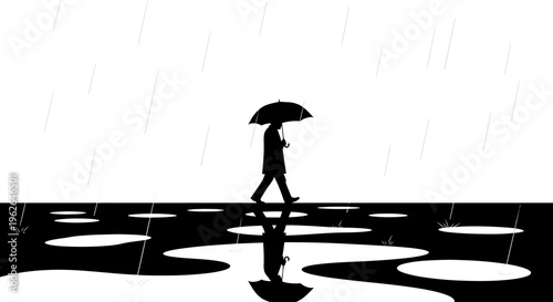 Man walking alone in the rain with a black umbrella