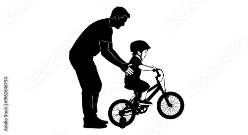 Father teaching young child to ride a bicycle with support
