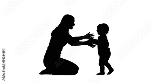 Mother and toddler sharing a tender moment in silhouette