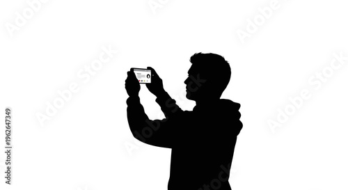 Silhouette of man taking a photo with his smartphone device
