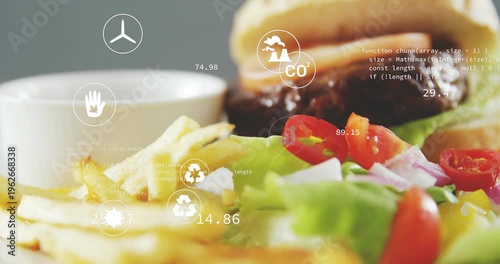 Burger and fries centering while camera zooming, overlays updating food CO2 recycling metrics