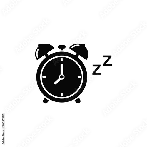 An alarm clock rings while sleeping at night indoors